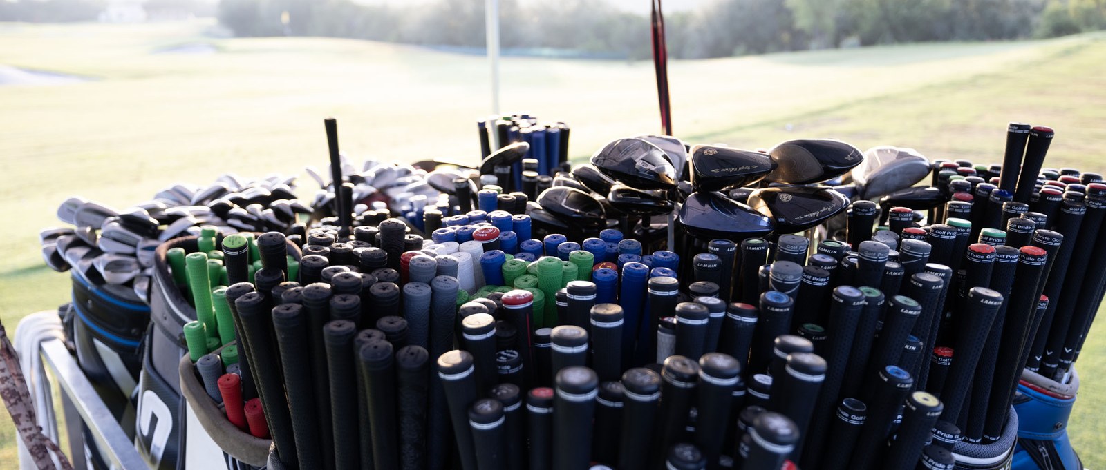 The demo rack on the fitting cart, packed with driver heads, irons and dozens of shafts and grips